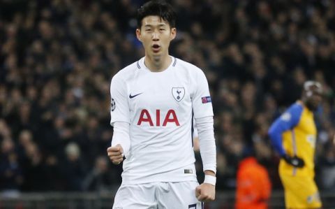 Tottenham's Son Heung-min, right, celebrates his goal against APOEL during the Champions League Group H soccer match between Tottenham and APOEL Nicosia in London, Wednesday, Dec. 6, 2017. (AP Photo/Frank Augstein)