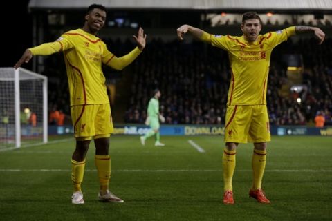 Liverpool's Daniel Sturridge, left, celebrates scoring his side's first goal with Alberto Moreno during the English FA Cup fifth round soccer match between Crystal Palace and Liverpool at Selhurst Park stadium in London, Saturday, Feb. 14, 2015.  (AP Photo/Matt Dunham)