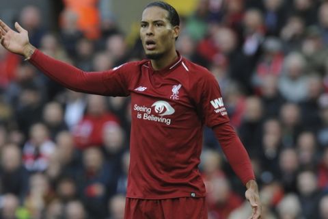 Liverpool's Virgil van Dijk appeals for a foul during the English Premier League soccer match between Liverpool and Manchester City at Anfield stadium in Liverpool, England, Sunday, Oct. 7, 2018. (AP Photo/Rui Vieira)