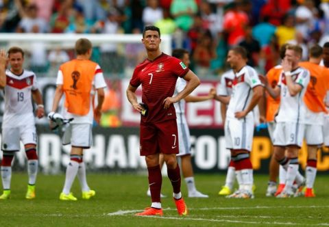 SALVADOR, BRAZIL - JUNE 16: A dejected Cristiano Ronaldo of Portugal looks on after being defeated by Germany 4-0 during the 2014 FIFA World Cup Brazil Group G match between Germany and Portugal at Arena Fonte Nova on June 16, 2014 in Salvador, Brazil.  (Photo by Phil Walter/Getty Images)