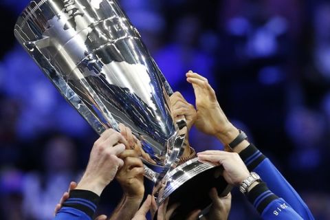 Team Europe celebrates with the Laver Cup after defeating Team World in the Laver Cup tennis tournament, Sunday, Sept. 23, 2018, in Chicago. (AP Photo/Jim Young)