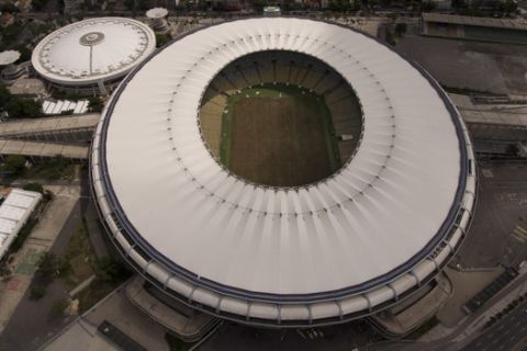FILE - In this file photo dated Feb. 2, 2017,  the Maracana stadium in Rio de Janeiro, Brazil.   Court testimonies published Wednesday April 12, 2017,  reveal that an investigation of Brazil's biggest constructor found new evidence of possible corruption in the building and financing of half of the 2014 World Cup stadiums, including the Maracana stadium in Rio. (AP Photo/Silvia Izquierdo, FILE)
