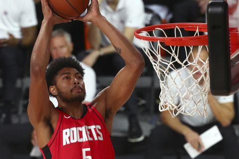 Houston Rockets forward Bruno Caboclo (5) dunks against the Philadelphia 76ers during the second half of a NBA basketball game Friday, Aug. 14, 2020, in Lake Buena Vista, Fla. (Kim Klement/Pool Photo via AP)