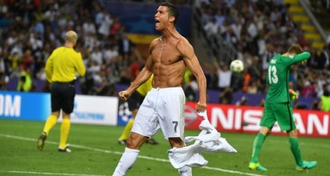 Real Madrid's Portuguese forward Cristiano Ronaldo celebrates after scoring during the penalty shoot-out in the UEFA Champions League final football match between Real Madrid and Atletico Madrid at San Siro Stadium in Milan, on May 28, 2016. / AFP / GERARD JULIEN        (Photo credit should read GERARD JULIEN/AFP/Getty Images)