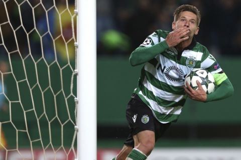 Sporting's Adrien Silva celebrates scoring his side's first goal during a Champions League, Group F soccer match between Sporting CP and Real Madrid at the Alvalade stadium in Lisbon, Tuesday, Nov. 22, 2016. (AP Photo/Steven Governo)
