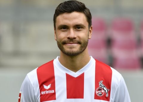 Cologne's Jonas Hector poses at the presentation of Bundesliga soccer club 1. FC Cologne for the new season at the stadium in Cologne, Germany, Monday, July 24, 2017. (AP Photo/Martin Meissner)