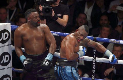 Britain's Dillian Whyte, right, and Dereck Chisora fight during the WBC heavyweight title eliminator boxing match in Manchester, England, Saturday, Dec. 10, 2016. (AP Photo/Dave Thompson)