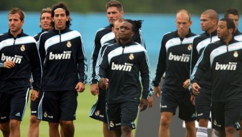 Real Madrid's Royston Drenthe, center, is seen with his teammates during their training session in Maynooth, Ireland, Wednesday July 15, 2009. Real Madrid are in Ireland for their pre season training and a soccer match against Shamrock Rovers on Monday. (AP Photo/Scott Heppell)