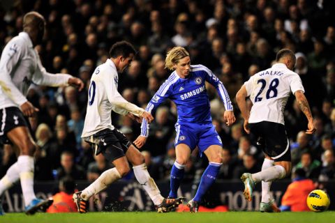 Chelsea's Spanish striker Fernando Torres (3rdL) tries to get past the Tottenham Hotspur defence during an English Premier League football match against Tottenham Hotspur at White Hart Lane in London, on December 22, 2011. AFP PHOTO/GLYN KIRK  
                                                                                                             
RESTRICTED TO EDITORIAL USE. No use with unauthorized audio, video, data, fixture lists, club/league logos or "live" services. Online in-match use limited to 45 images, no video emulation. No use in betting, games or single club/league/player publications. (Photo credit should read GLYN KIRK/AFP/Getty Images)