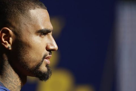 FC Barcelona new signing Kevin-Prince Boateng stands on the pitch during his presentation at the Camp Nou stadium in Barcelona, Spain, Tuesday, Jan. 22, 2019. Barcelona surprisingly signed Kevin-Prince Boateng on loan from Italian club Sassuolo on Monday until the end of the season. The 31-year-old Boateng has appeared to be past his prime after playing for the likes of AC Milan, Borussia Dortmund, Schalke, and Tottenham. (AP Photo/Emilio Morenatti)