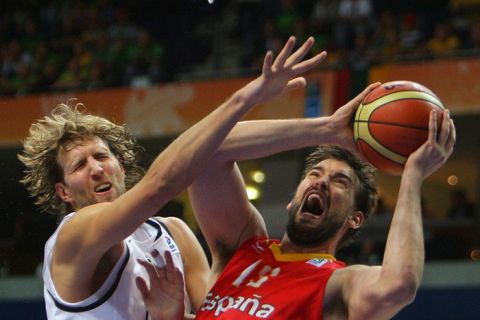 Germany's Dirk Nowitzki (L) vies with Spain's Marc Gasol (R) during their Euro Basket 2011 group E second round qualification match between Spain and Germany in Vilnius on September 7, 2011.     AFP PHOTO/ PETRAS MALUKAS (Photo credit should read PETRAS MALUKAS/AFP/Getty Images)