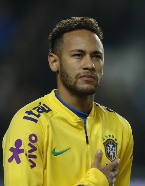 Brazil's Neymar stands during the anthem prior the International friendly soccer match between Brazil and Cameroon at MK Stadium in Milton Keynes, England, Tuesday, Nov. 20, 2018 . (AP Photo/Frank Augstein)