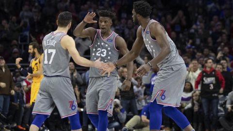 Philadelphia 76ers' Jimmy Butler, center, celebrates with JJ Redick, left, and Joel Embiid, right, of Cameroon, during the second half of an NBA basketball game against the Utah Jazz, Friday, Nov. 16, 2018, in Philadelphia(AP (AP Photo/Chris Szagola)