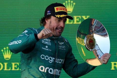 Aston Martin driver Fernando Alonso of Spain celebrates with his trophy after finishing 3rd in the Australian Formula One Grand Prix at Albert Park in Melbourne, Sunday, April 2, 2023. (AP Photo/Asanka Brendon Ratnayake)