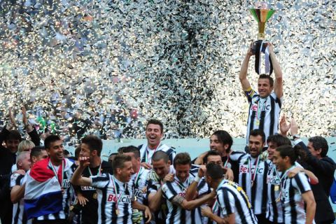 Juventus' forward Alessandro Del Piero holds the Italian Serie A trophy, the Scudetto, after their match against Atalanta on May 13, 2012 in Juventus stadium in Turin. Juve have officially won 28 titles due to having been stripped of their 2005 and 2006 successes for match-fixing and Del Piero's 19-year stay with the Old Lady Juventus  will come to an end this summer.    AFP PHOTO / OLIVIER MORINOLIVIER MORIN/AFP/GettyImages