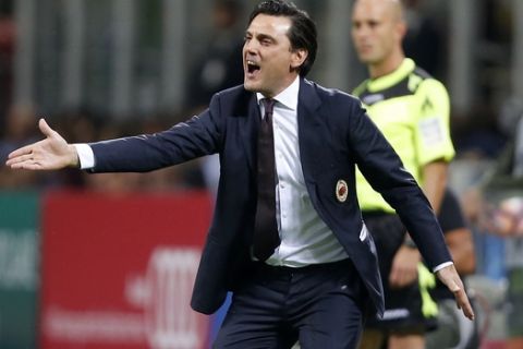 AC Milan coach Vincenzo Montella shouts instructions to his players during the Serie A soccer match between AC Milan and Lazio at the San Siro stadium in Milan, Italy, Tuesday, Sept. 20, 2016. (AP Photo/Antonio Calanni)