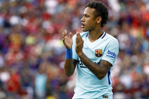 Barcelona forward Neymar walks on the field before an International Champions Cup soccer match against Manchester United, Wednesday, July 26, 2017, in Landover, Md. (AP Photo/Patrick Semansky)