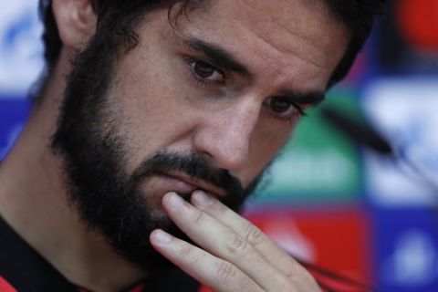 FILE - In this Oct. 22, 2018 file photo, Real Madrid's Isco attends a press conference at the team's Valdebebas training ground in Madrid, Spain. Tapped to be the successor of Andres Iniesta and Xavi Hernandez in the long line of Spanish midfielders, nobody doubts the superb vision and passing skills of Francisco Isco Alarcon.  (AP Photo/Manu Fernandez, file)