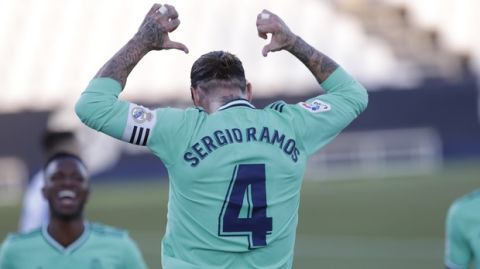Real Madrid's captain Sergio Ramos celebrates during the Spanish La Liga soccer match between Leganes and Real Madrid at the Butarque Stadium in Leganes, on the outskirts of Madrid, Spain, Sunday, July 19, 2020. (AP Photo/Bernat Armangue)