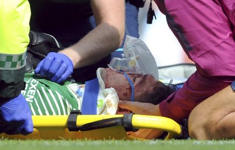 Manchester City's goalkeeper Ederson receives medical treatment during the English Premier League soccer match between Manchester City and Liverpool at the Etihad Stadium in Manchester, England, Saturday, Sept. 9, 2017. (AP Photo/Rui Vieira)