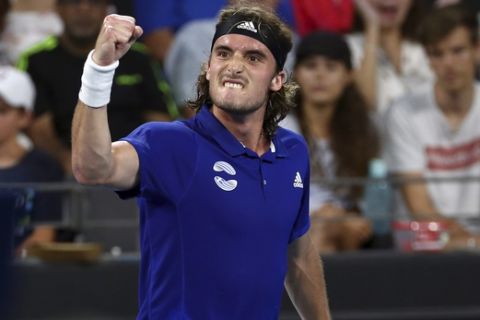 Stefanos Tsitsipas of Greece reacts after winning the first set during his match against Alexander Zverev of Germany at the ATP Cup tennis tournament in Brisbane, Australia, Sunday, Jan. 5, 2020. (AP Photo/Tertius Pickard)