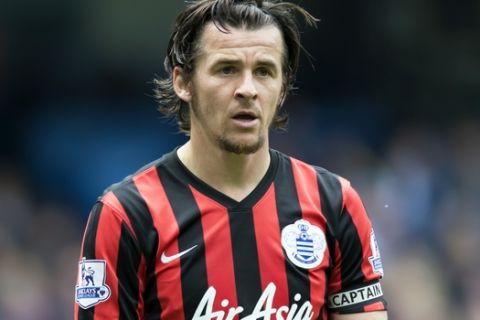 FILE - In this Sunday, May 10, 2015 file photo, Queens Park Rangers' Joey Barton watches the ball during their English Premier League soccer match at the Etihad Stadium, Manchester, England. After a short and ill-fated stint in Scottish football, Joey Barton is back in the English Premier League with former club Burnley. Burnley said Tuesday, Dec. 20, 2016 that the 34-year-old Barton has agreed to a deal until the end of the season, subject to international clearance when the transfer window opens in January. (AP Photo/Jon Super, file)