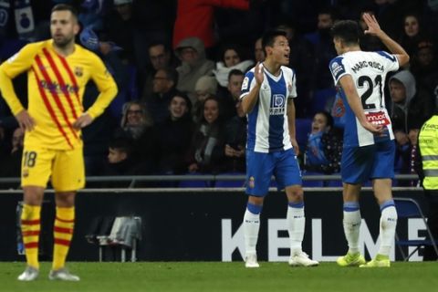 Espanyol's Wu Lei, second right, celebrates after scoring his side's second goal during the Spanish La Liga soccer match between Espanyol and Barcelona at the RCDE Stadium in Barcelona, Spain, Saturday, Jan. 4, 2020. (AP Photo/Joan Monfort)