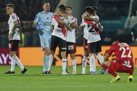 Players of Argentina's River Plate celebrates after a quarter final second leg Copa Libertadores soccer match against Paraguay's Cerro Porteno in Asuncion, Paraguay, Thursday, Aug. 29, 2019. The game ended in a 1-1 tie and River Plate qualified to semi final series on a 3-1 aggregate score. (AP Photo/Jorge Saenz)