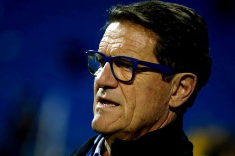 Former Real Madrid's coach Fabio Capello waits to be interviewed by a TV crew before a Spanish La Liga soccer match between Real Madrid and Las Palmas at the Santiago Bernabeu stadium in Madrid, Spain, Wednesday, March 1, 2017. (AP Photo/Paul White)