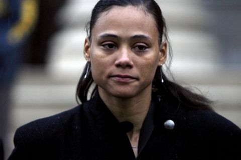 **FILE**In this Jan. 11, 2008 file photo, former Olympic champion Marion Jones leaves after being sentenced at the Westchester County Federal Courthouse in White Plains, N.Y.  Disgraced Olympic track star Marion Jones has asked President Bush to commute her six-month prison sentence for lying to federal agents about her use of performance-enhancing drugs and a check-fraud scam the Justice Department confirmed Monday July 21, 2008.  (AP Photo/Jason DeCrow, file)