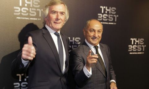 Former Northern Ireland soccer player Pat Jennings and former Argentinian soccer player Ossie Ardelez, right, arrive to attend The Best FIFA 2017 Awards at the Palladium Theatre in London, Monday, Oct. 23, 2017. (AP Photo/Alastair Grant)