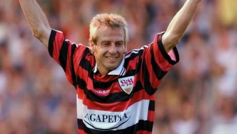 German soccer star Juergen Klinsmann celebrates his goal in his farewell match between the VfB Stuttgart All Stars and Juergen's Dream Team in Stuttgart's Gottlieb Daimler stadium Monday, May 24, 1999. Klinsmann played 108 times in the German national soccer team and was in the German team that won the 1990 World Cup . He played as a professional for the teams of Kickers Stuttgart, VfB Stuttgart, Bayern Munich, AS Monaco, Tottenham Hotspur, Inter Milan and Sampdoria Genoa. The 34-year-old forward liveswith his wife and son in California. (AP Photo/Thomas Kienzle)