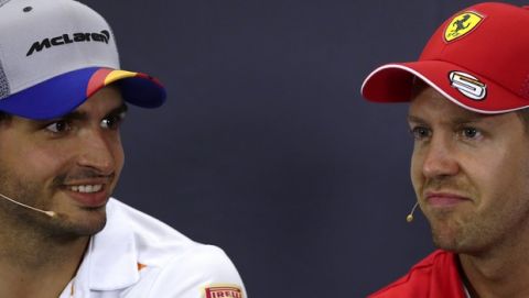 McLaren's Spanish driver Carlos Sainz Jr, left, and Ferrari's German driver Sebastian Vettel attend a press conference at the Barcelona Catalunya racetrack in Montmelo, Spain, Thursday, May 9, 2019. The Formula One race will be held on Sunday. (AP Photo/Manu Fernandez)