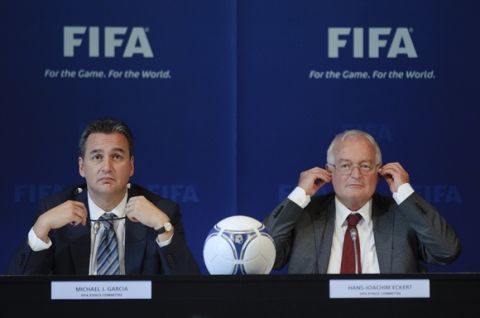 Michael J Garcia (L), Chairman of the investigatory chamber of the FIFA Ethics Committee, and Hans-Joachim Eckert (R), Chairman of the adjudicatory chamber of the FIFA Ethics Committee, gesture during a press conference at the FIFA's headquarter on July 27, 2012, in Zurich.  AFP PHOTO / SEBASTIEN BOZON        (Photo credit should read SEBASTIEN BOZON/AFP/GettyImages)
