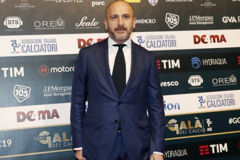 Piero Ausilio poses for photographer as he arrives for the Gran Gala' soccer awards ceremony, in Milan, Italy, Monday, Dec. 2, 2019. (AP Photo/Antonio Calanni)