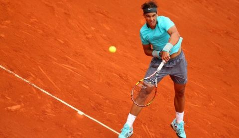 PARIS, FRANCE - JUNE 02:  Rafael Nadal of Spain serves in his men's singles match against Dusan Lajovic of Serbia on day nine of the French Open at Roland Garros on June 2, 2014 in Paris, France.  (Photo by Clive Brunskill/Getty Images)