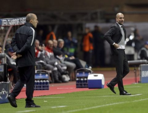 Manchester City's manager Pep Guardiola, right, and Monaco's head coach Leonardo Jardim watch their players during a Champions League round of 16 second leg soccer match between Monaco and Manchester City at the Louis II stadium in Monaco, Wednesday March 15, 2017. (AP Photo/Claude Paris)