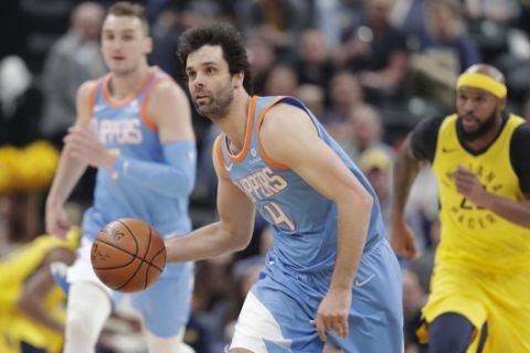 Los Angeles Clippers guard Milos Teodosic (4) brings the ball up court against the Indiana Pacers during the first half of an NBA basketball game in Indianapolis, Friday, March 23, 2018. (AP Photo/Michael Conroy)