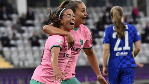 Barcelona's Aitana Bonmati, left, celebrates with Barcelona's Lieke Martens after scoring her side's third goal during the UEFA Women's Champions League final soccer match between Chelsea FC and FC Barcelona in Gothenburg, Sweden, Sunday, May 16, 2021. (AP Photo/Martin Meissner)