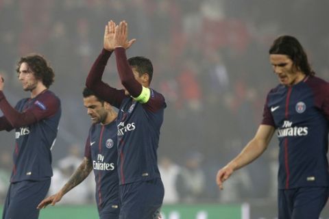 PSG players greet fans after losing the Champions League round of sixteen second leg soccer match between Paris St. Germain and Real Madrid at the Parc des Princes stadium in Paris, France, Tuesday, March 6, 2018. (AP Photo/Christophe Ena)