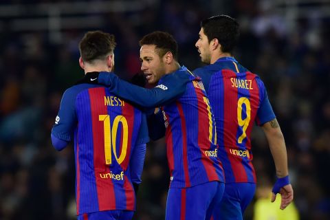 FC Barcelona's Neymar Jr.right, celebrates his goal with Lionel Messi, left, and Luis Suarez after after scoring during the Spanish Copa del Rey, quarter final, first leg soccer match, between FC Barcelona and Real Sociedad, at Anoeta stadium, in San Sebastian, northern Spain, Thursday, Jan.19, 2017. (AP Photo/Alvaro Barrientos)