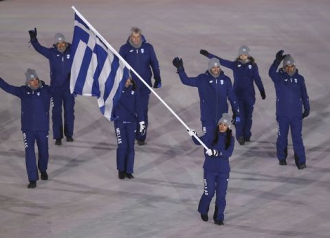 Sophia Ralli carries the flag of Greece during the opening ceremony of the 2018 Winter Olympics in Pyeongchang, South Korea, Friday, Feb. 9, 2018. (AP Photo/Michael Sohn)