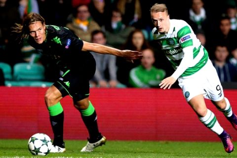 Moenchengladbach's Jannik Vestergaard, left, and Celtic's Leigh Griffiths go for the ball during the Champions League group C soccer match between Celtic and Borussia Moenchengladbach at Celtic Park, Glasgow, Scotland, Wednesday Oct. 19, 2016. (AP Photo/Scott Heppell)