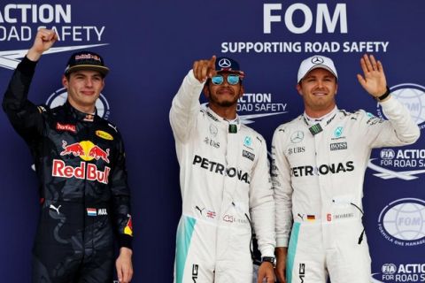NORTHAMPTON, ENGLAND - JULY 09: Top three qualifiers Lewis Hamilton of Great Britain and Mercedes GP, Nico Rosberg of Germany and Mercedes GP and Max Verstappen of Netherlands and Red Bull Racing celebrate in parc ferme during qualifying for the Formula One Grand Prix of Great Britain at Silverstone on July 9, 2016 in Northampton, England.  (Photo by Mark Thompson/Getty Images)