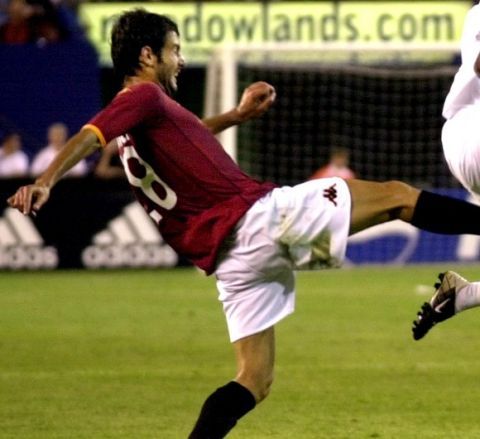Real Madrid Flavio Conceicao, right, controls the ball as A.S Roma midfielder Josep Guardiola attempts to take it away during the second half of their friendly match Thursday night, Aug. 8, 2002, at Giants Stadium in East Rutherford, N.J.  (AP Photo/Bill Kostroun)