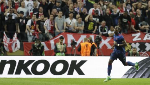 Manchester's Paul Pogba celebrates after scoring the opening goal during the soccer Europa League final between Ajax Amsterdam and Manchester United at the Friends Arena in Stockholm, Sweden, Wednesday, May 24, 2017. (AP Photo/Michael Sohn)