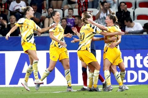 Australia's Elise Kellond-Knight, right, celebrates after scoring her team first goal during the Women's World Cup round of 16 soccer match between Norway and Australia at the Stade de Nice in Nice, France, Saturday, June 22, 2019. (AP Photo/Thibault Camus)