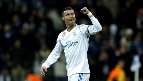 Real Madrid's Cristiano Ronaldo celebrates after scoring his side's second goal during the Champions League Group H soccer match between Real Madrid and Borussia Dortmund at the Santiago Bernabeu stadium in Madrid, Spain, Wednesday, Dec. 6, 2017. (AP Photo/Francisco Seco)