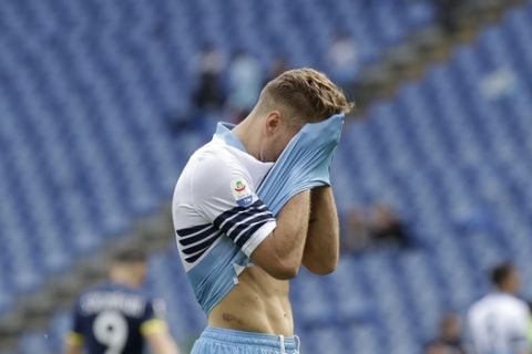Lazio's Ciro Immobile reacts after missing a scoring chance during a Serie A soccer match between Lazio and Chievo Verona at Rome's Olympic stadium, Saturday, April 20, 2019. (AP Photo/Alessandra Tarantino)