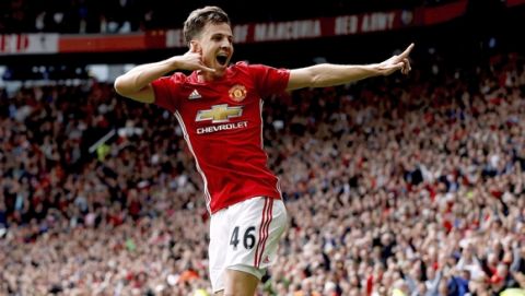 Manchester United's Josh Harrop celebrates scoring his side's first goal of the game during the English Premier League soccer match between Manchester United and Crystal Palace, at Old Trafford, in Manchester, England, Sunday, May 21, 2017. (Martin Rickett/PA via AP)